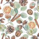 et billede af en juleserviet, med en kanelstang, kogler, en appelsin og andet. 